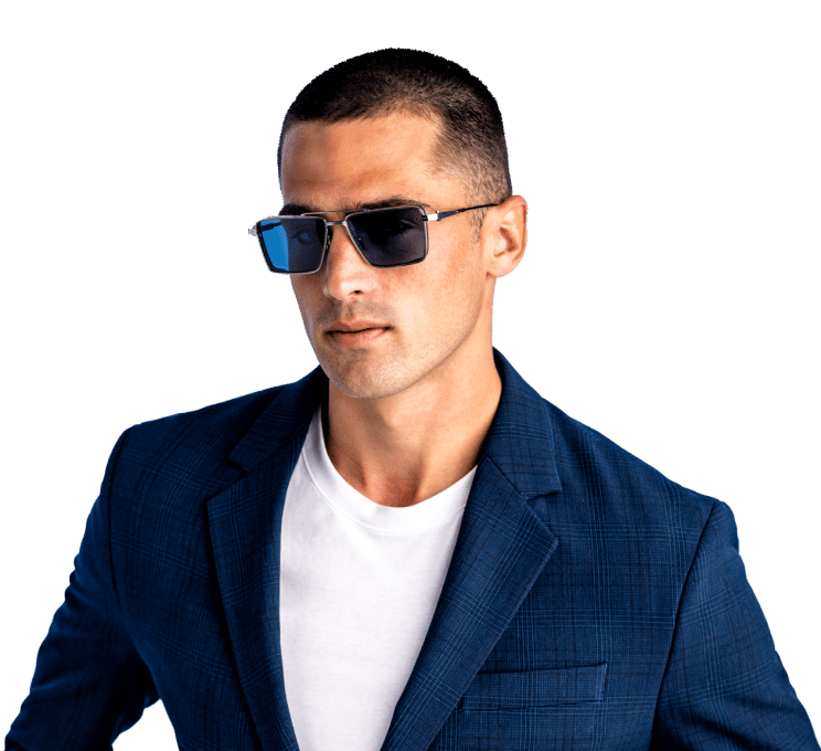 Explore Designer Sunglasses & Luxury Eyewear | Edward Beiner | Caucasian Man in a blue suit wearing Designer Sunglasses